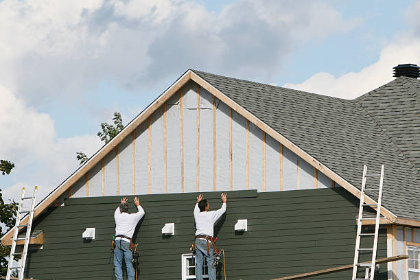 Professional Storm Damage Siding Repair technician working in Olivia, NC